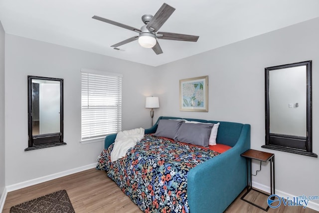 110 SW Cotton Bend Dr, Huntsville, AL 35824 - bedroom with wood finished floors, baseboards, and ceiling fan