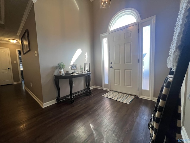 foyer featuring baseboards and dark wood-style flooring