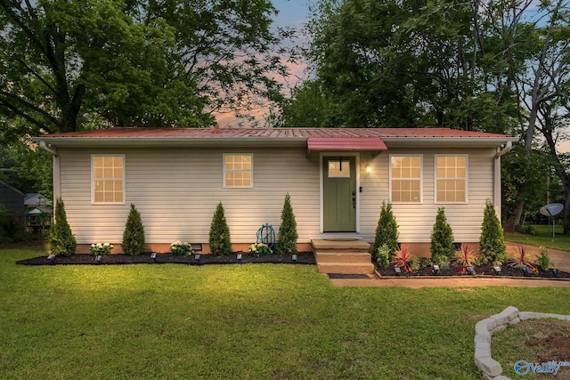 3516 Oleander Rd SW, Huntsville, AL 35805 - view of front of house with crawl space, metal roof, and a front lawn