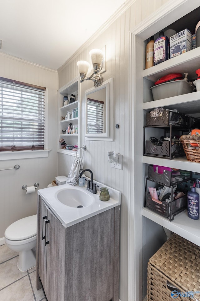 3516 Oleander Rd SW, Huntsville, AL 35805 - half bathroom with crown molding, vanity, toilet, tile patterned floors, and wood walls