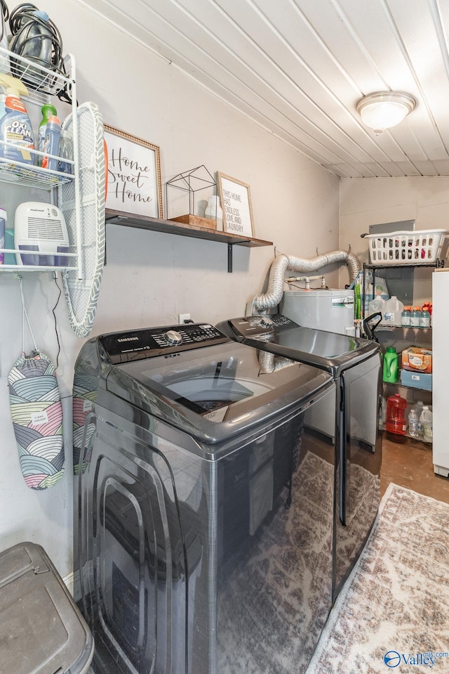 3516 Oleander Rd SW, Huntsville, AL 35805 - clothes washing area featuring washing machine and clothes dryer, laundry area, and water heater