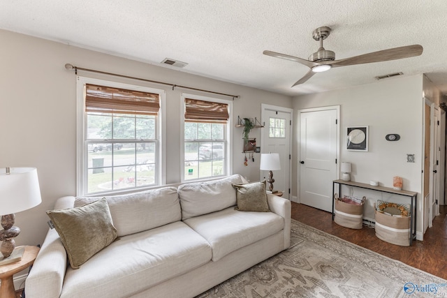 3516 Oleander Rd SW, Huntsville, AL 35805 - living area featuring wood finished floors, a ceiling fan, a textured ceiling, and visible vents