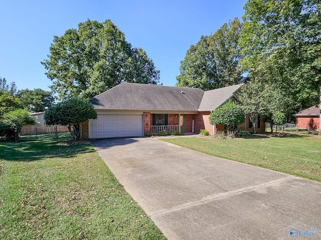 single story home with a garage and a front yard