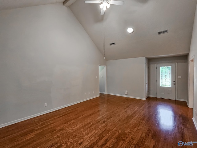 empty room featuring high vaulted ceiling, ceiling fan, beamed ceiling, and dark wood-type flooring