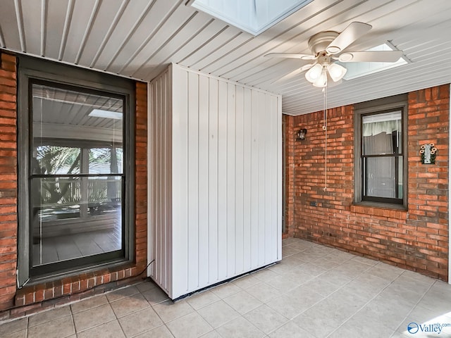 interior space with ceiling fan