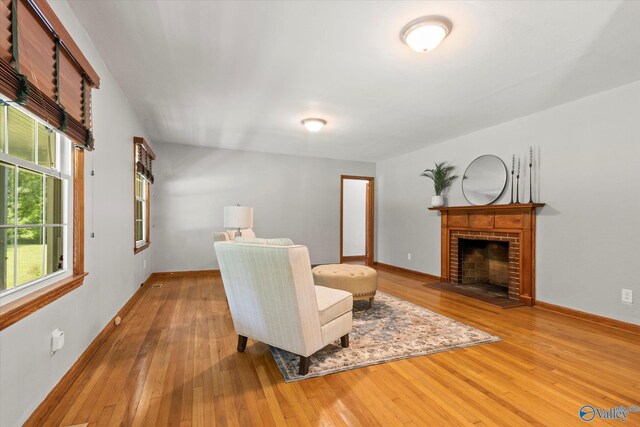 interior details featuring a fireplace and hardwood / wood-style flooring