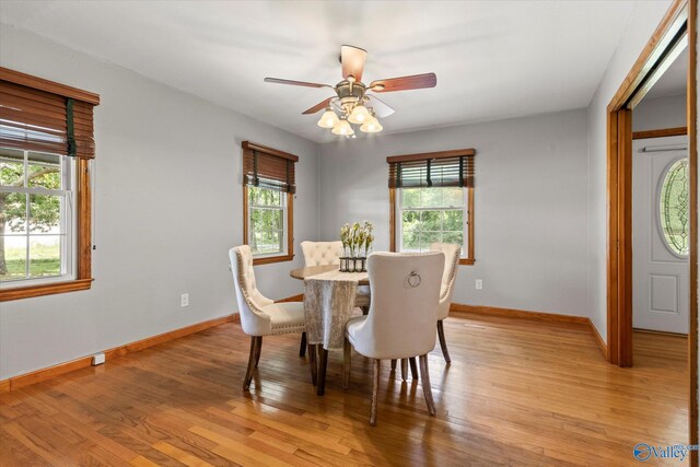 kitchen with track lighting, tasteful backsplash, stainless steel gas stove, and ceiling fan