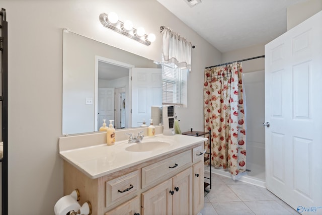 bathroom featuring tile patterned floors, a shower with curtain, and vanity