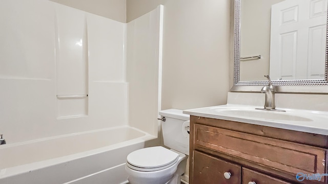 full bath featuring tub / shower combination, vanity, and toilet