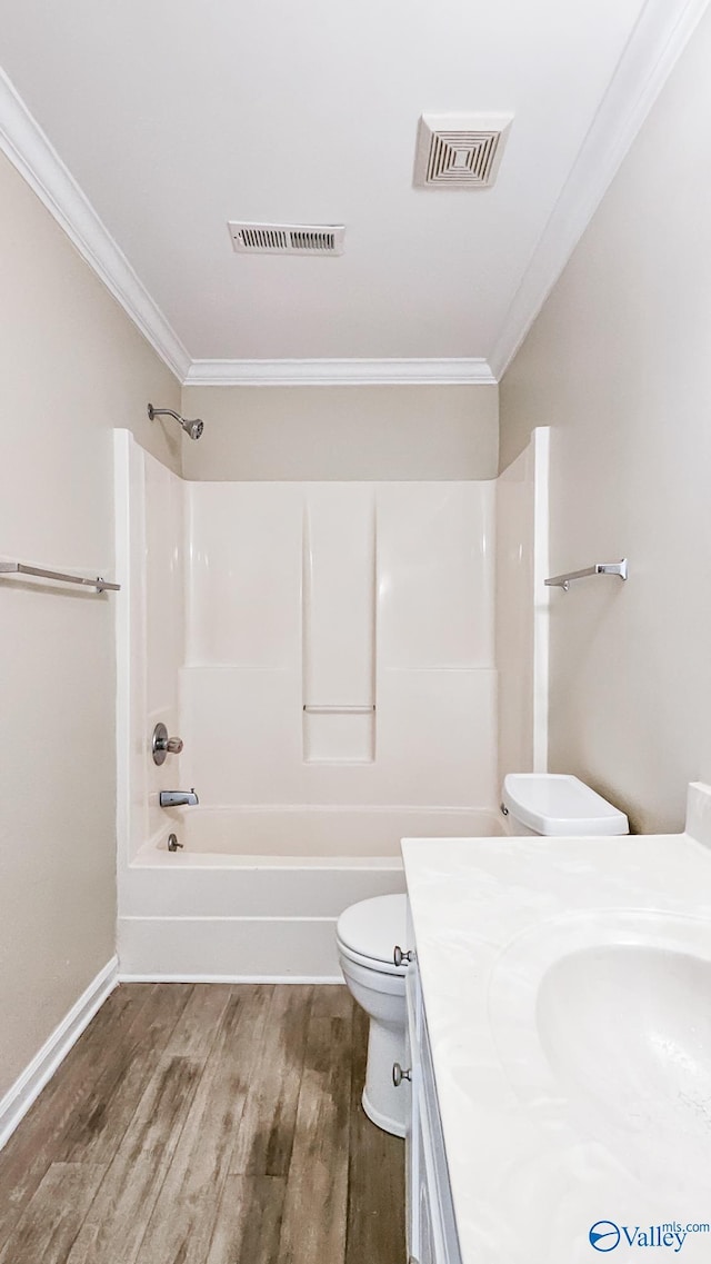 full bath with toilet, visible vents, wood finished floors, and ornamental molding