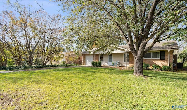 view of front facade featuring a front lawn, driveway, a porch, brick siding, and a garage