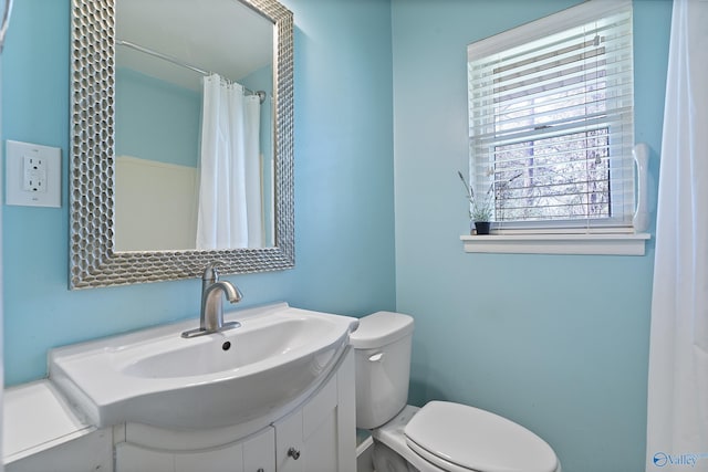 full bathroom featuring vanity and toilet