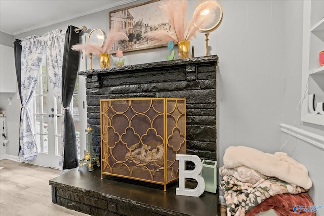 details with hardwood / wood-style flooring and crown molding