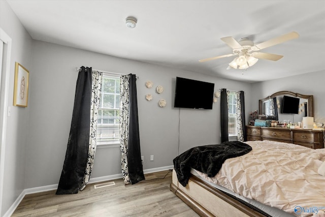 bedroom featuring light wood-type flooring and ceiling fan