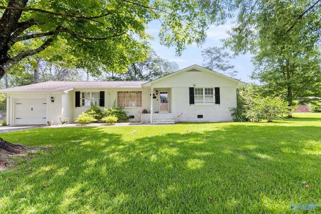 ranch-style home featuring a front lawn and a garage