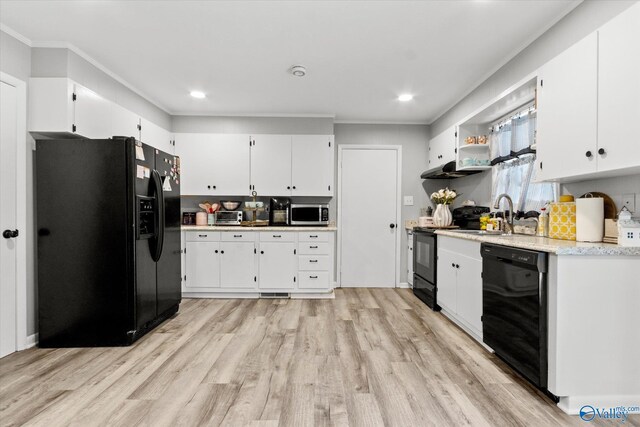 kitchen featuring white cabinetry, light hardwood / wood-style flooring, black appliances, sink, and ornamental molding