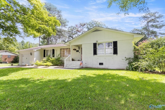 ranch-style home with a garage and a front lawn