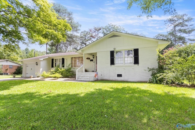 ranch-style home with a front lawn and a garage