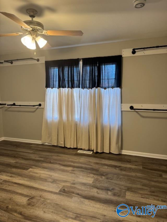 bathroom with hardwood / wood-style floors and ceiling fan