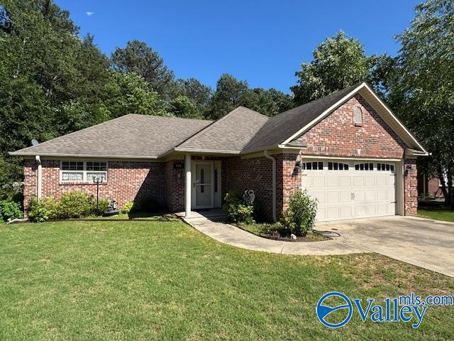 418 Santana Dr, Athens, AL 35611 - ranch-style house featuring a garage, brick siding, a front yard, and concrete driveway