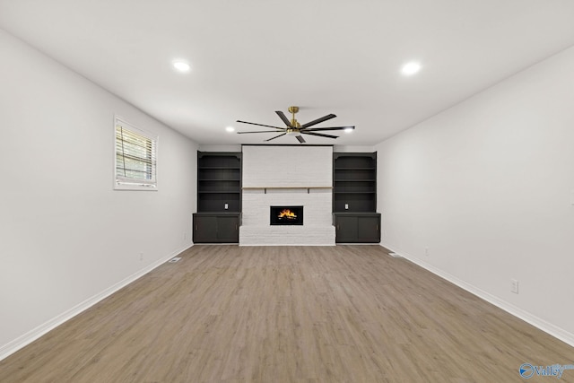 unfurnished living room featuring baseboards, a ceiling fan, and recessed lighting