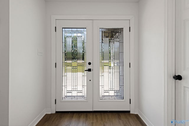 entryway featuring baseboards, dark wood-style floors, and french doors