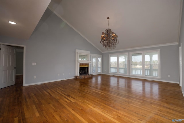 1204 Sibert Dr, Glencoe, AL 35905 - unfurnished living room with a chandelier, baseboards, wood finished floors, high vaulted ceiling, and ornamental molding