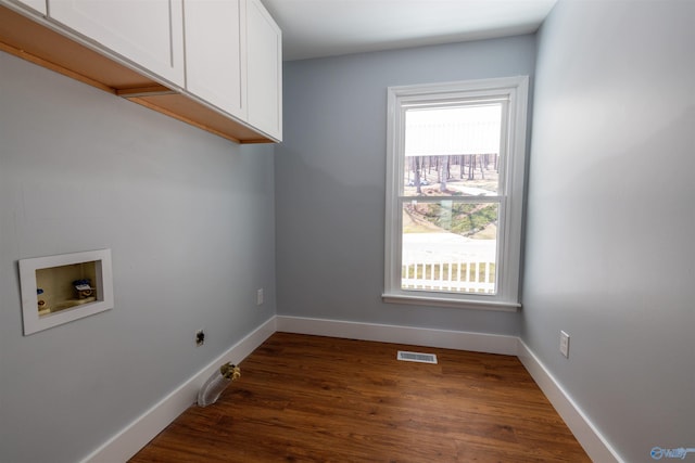 1204 Sibert Dr, Glencoe, AL 35905 - laundry area with cabinet space, hookup for a washing machine, dark wood-style floors, baseboards, and hookup for a gas dryer