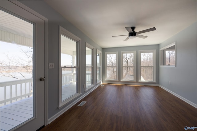1204 Sibert Dr, Glencoe, AL 35905 - unfurnished sunroom featuring baseboards and wood finished floors