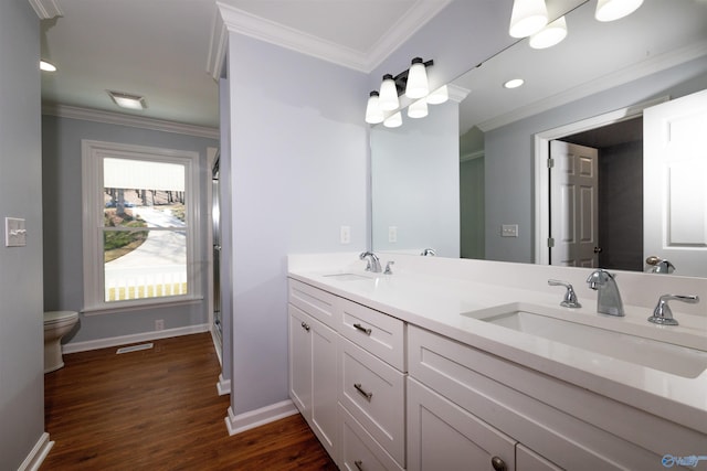 1204 Sibert Dr, Glencoe, AL 35905 - bathroom with double vanity, ornamental molding, wood finished floors, toilet, and baseboards