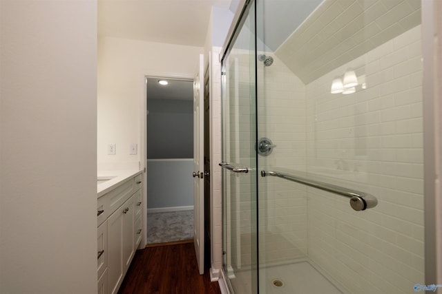 1204 Sibert Dr, Glencoe, AL 35905 - full bathroom with wood finished floors, a stall shower, and vanity
