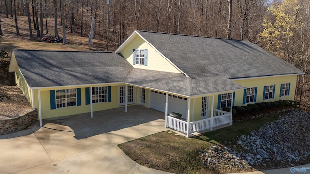 1204 Sibert Dr, Glencoe, AL 35905 - view of front of house with driveway, roof with shingles, a porch, and a garage