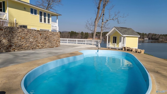 1204 Sibert Dr, Glencoe, AL 35905 - view of swimming pool with an outbuilding and a water view