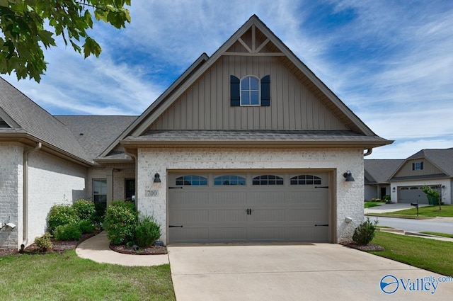 view of front facade with a front yard and a garage