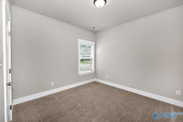 empty room with carpet flooring