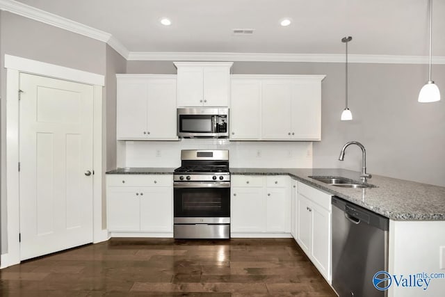 kitchen with sink, white cabinetry, stainless steel appliances, and hanging light fixtures