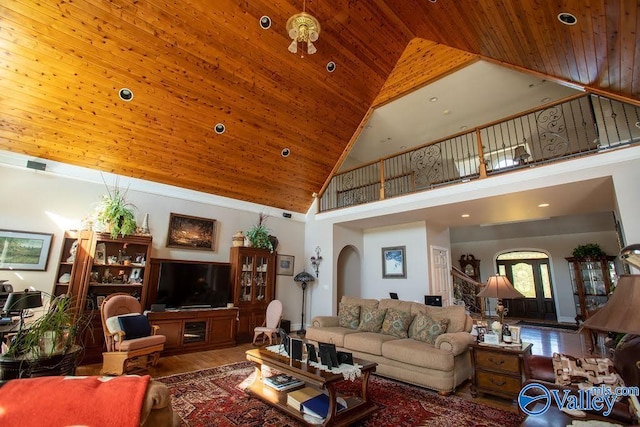 living room featuring wood-type flooring, high vaulted ceiling, and wood ceiling