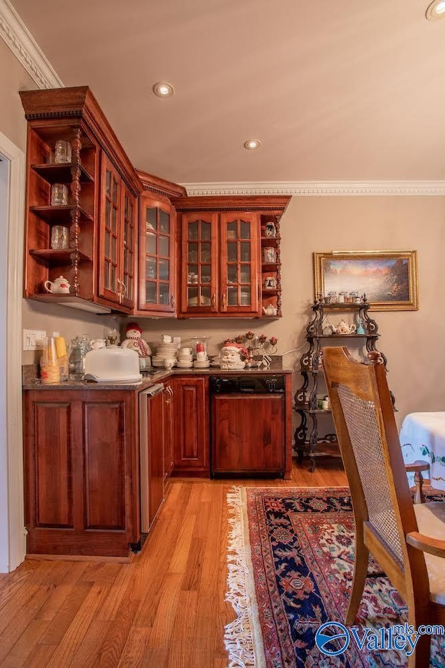 kitchen featuring dishwasher, light wood-type flooring, and crown molding