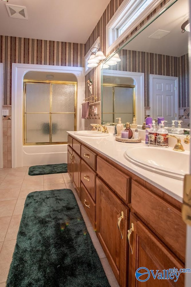 bathroom featuring tile patterned floors and dual bowl vanity