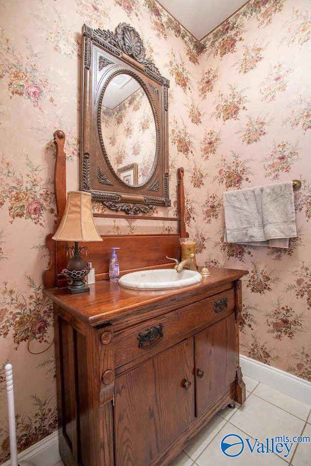 bathroom with tile patterned floors and vanity