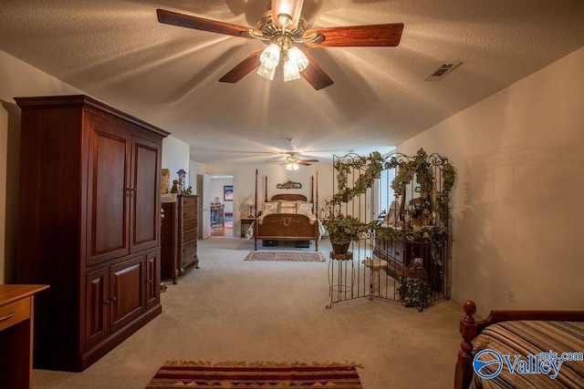 bedroom with carpet flooring and a textured ceiling