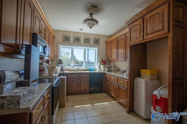 kitchen featuring light tile patterned floors, a textured ceiling, electric stove, black dishwasher, and sink