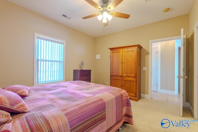 5590 Bay Hill Dr Unit 303, Athens, AL 35611 - bedroom with light carpet, ceiling fan, and baseboards