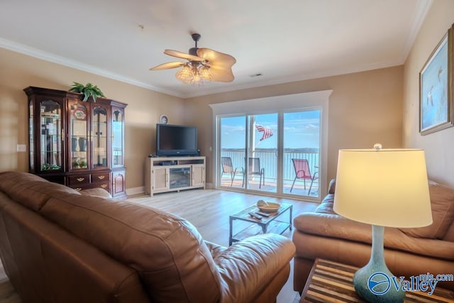 5590 Bay Hill Dr Unit 303, Athens, AL 35611 - living area featuring wood finished floors, crown molding, ceiling fan, and baseboards