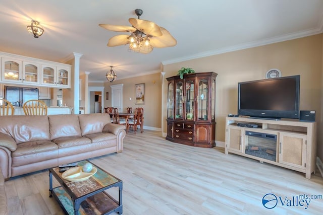5590 Bay Hill Dr Unit 303, Athens, AL 35611 - living area with ornamental molding, a ceiling fan, light wood-style flooring, baseboards, and ornate columns