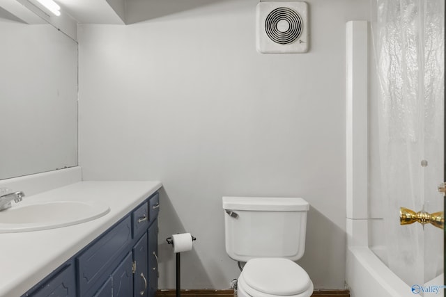 full bathroom with vanity, toilet, and shower / bath combo with shower curtain