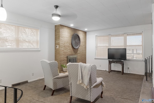 dining room featuring a fireplace and carpet floors