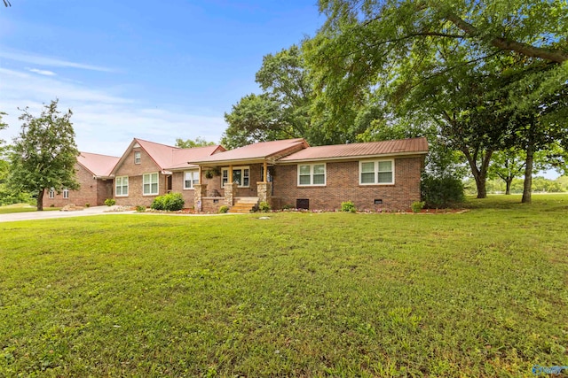 ranch-style home with a front lawn