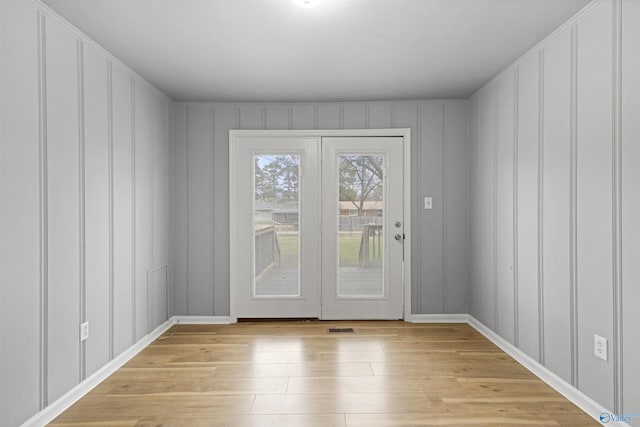 doorway to outside with light hardwood / wood-style flooring