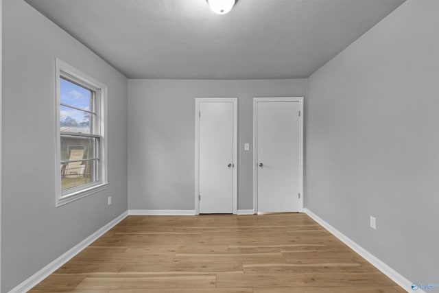 spare room with light wood-type flooring